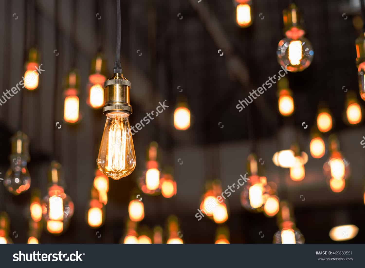 Stock Photo Vintage Style Light Bulbs Hanging From The Ceiling Stock Photo Vintage Style Light Bulbs Hanging From The Ceiling 469683551