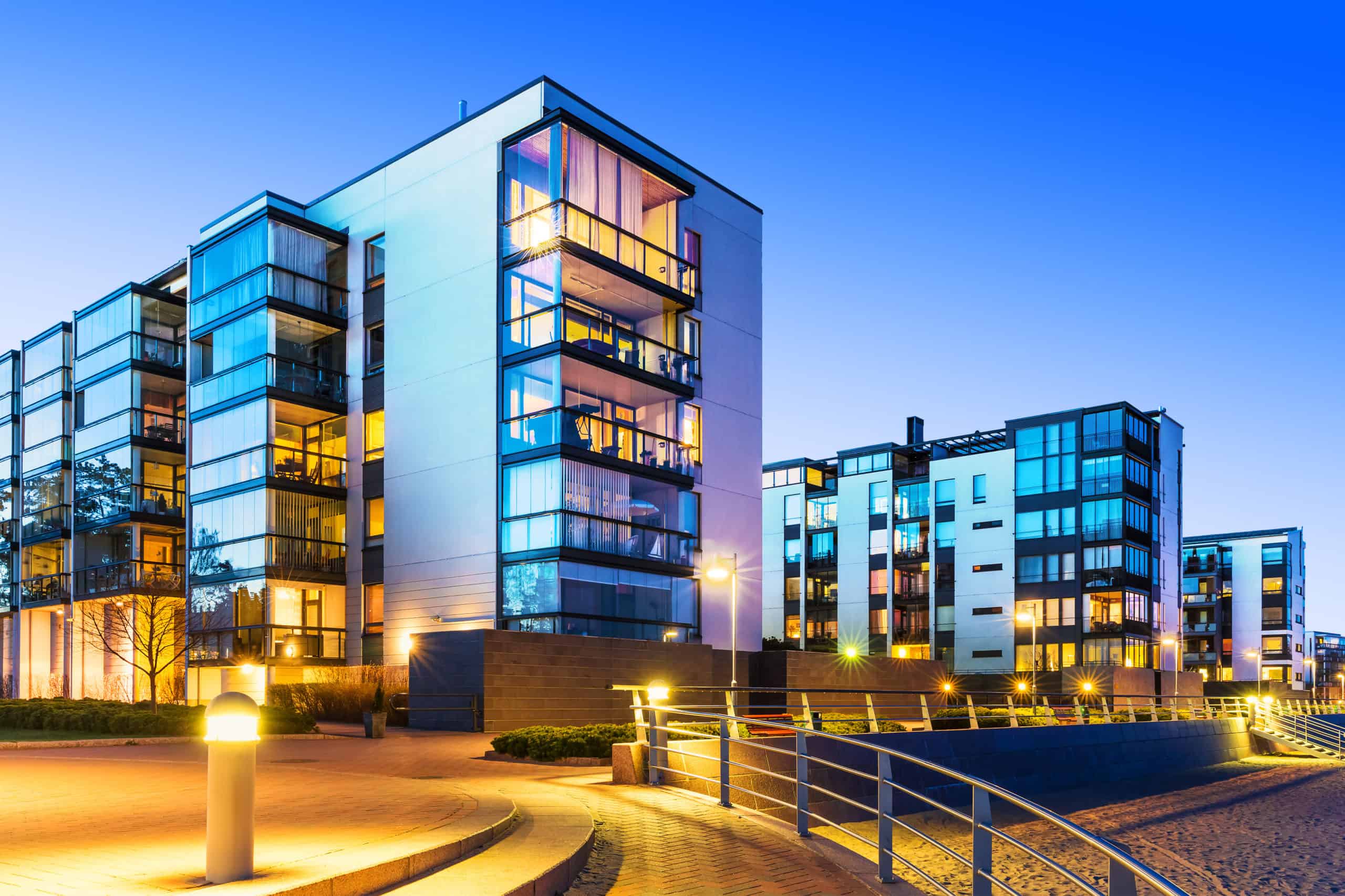 Apartment Complex by beach with glass patios