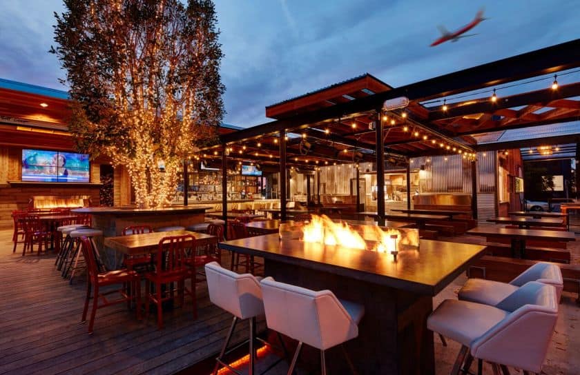 Picture of outdoor patio with string lighting and fire pit