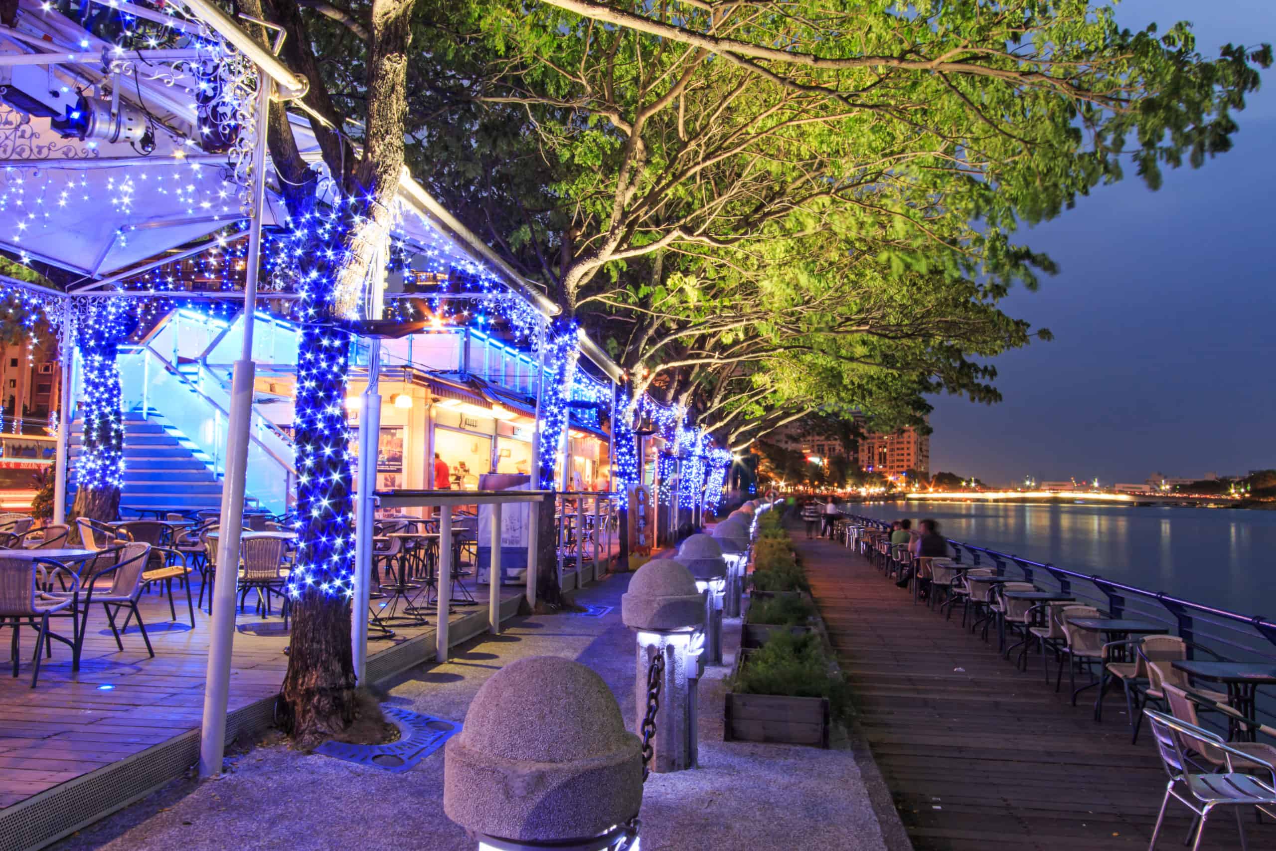 Restaurants along the famouse Love River of Kaohsung. Outdoor Patio next to water with Blue string lights