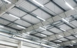 Large warehouse ceiling showing off bright lights