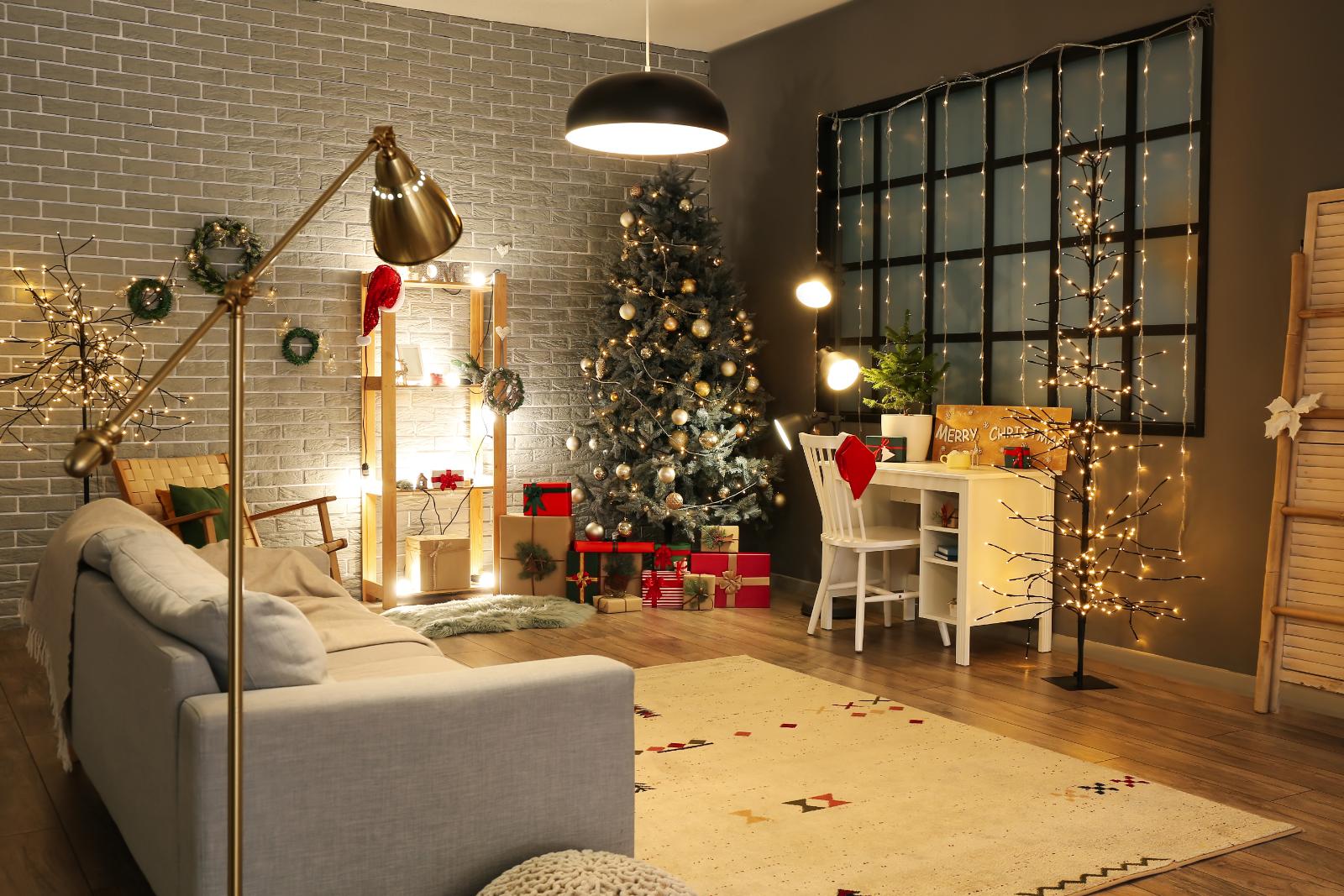 Livingroom with holiday decorations and a Christmas tree in the far corner of the room